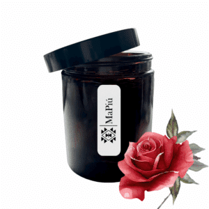 apothecary style scented candle in glass container with orange geranium clove patchouli black rose and oud fragrance